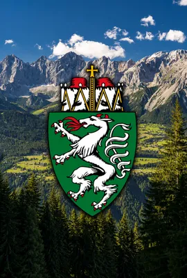 Wappen der Steiermark vor Alpenlandschaft